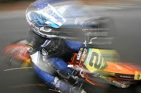 A KTM 450 races a 250cc Superkart